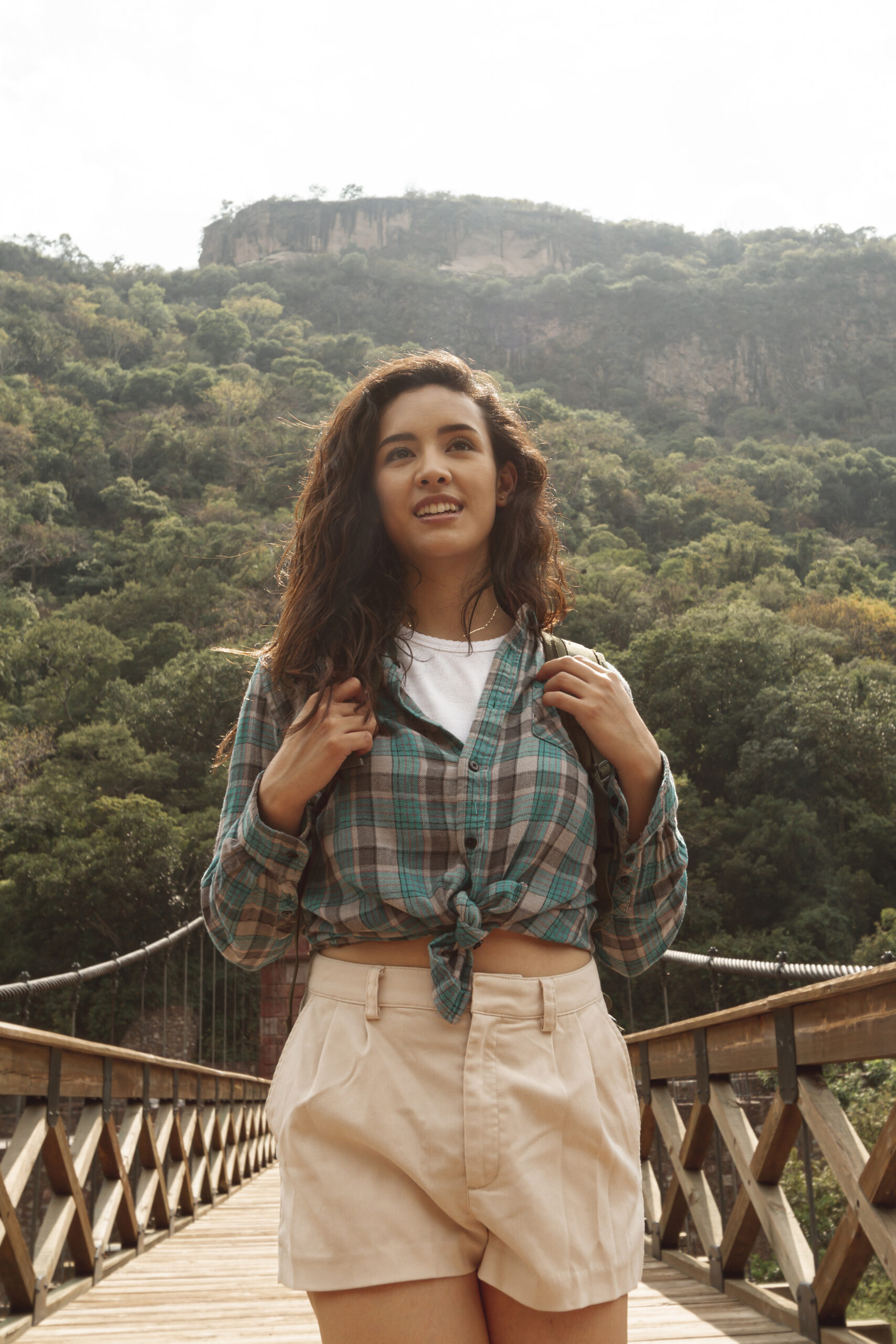 low-angle-female-traveler-bridge