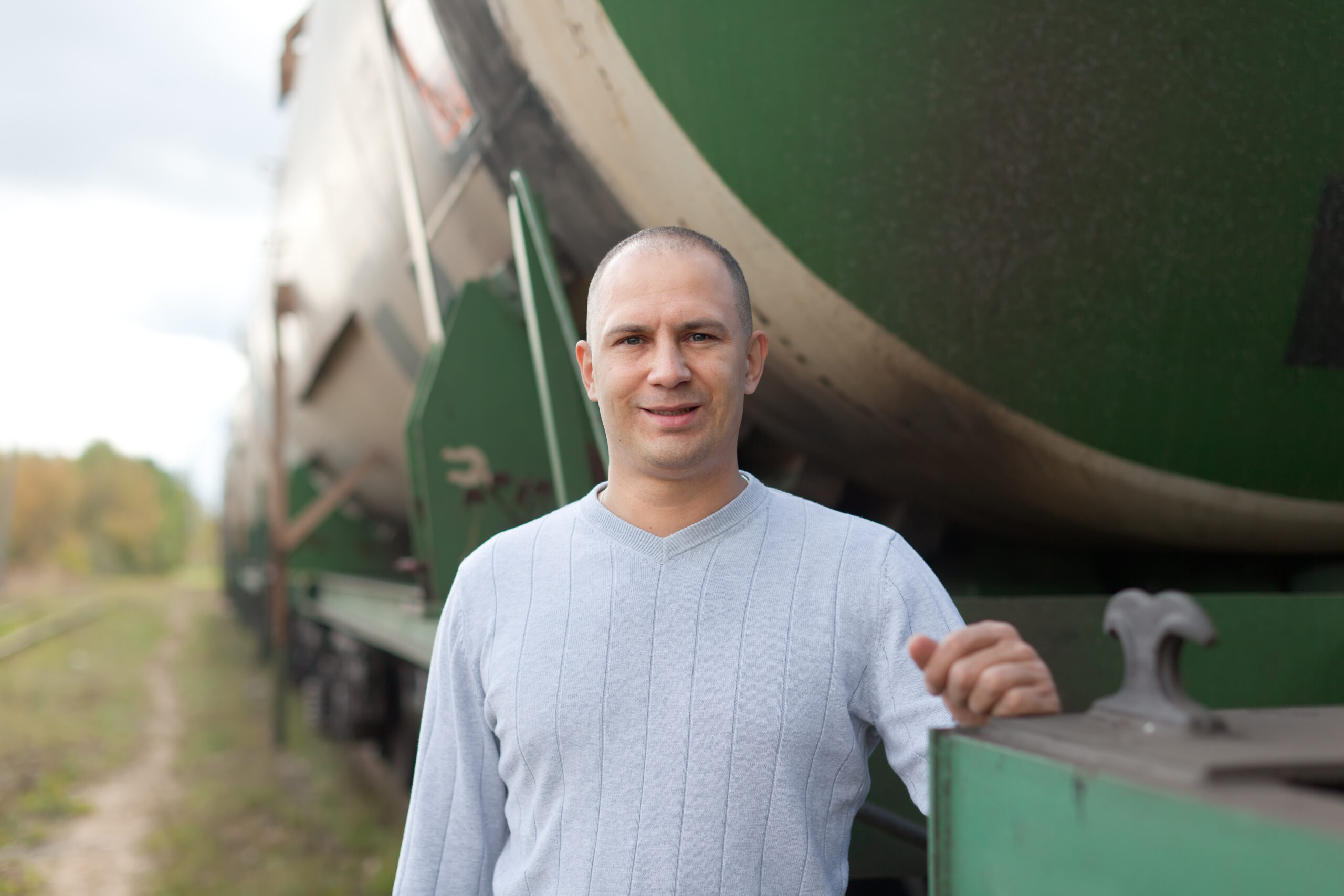 worker near cistern car  at railway